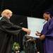 Pioneer's Principal Cyntia Leaman hands a graduate her diploma during Pioneer's 2013 graduation ceremony at EMU's Convocation Center, Thursday June 6. Courtney Sacco I AnnArbor.com
